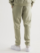 Fear of God Essentials - Tapered Logo-Print Cotton-Blend Jersey Sweatpants - Green