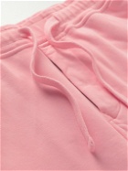 Stone Island - Tapered Logo-Appliquéd Garment-Dyed Cotton-Jersey Sweatpants - Pink
