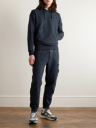 Stone Island - Tapered Logo-Appliquéd Garment-Dyed Cotton-Jersey Sweatpants - Blue