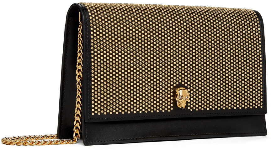 Black shops and gold studded bag