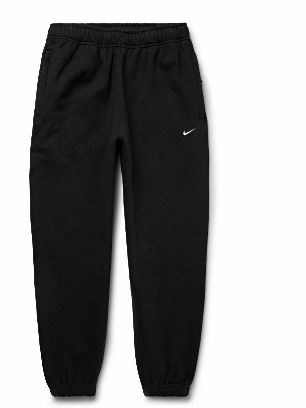 Photo: Nike - Solo Swoosh Tapered Logo-Embroidered Cotton-Blend Jersey Sweatpants - Black