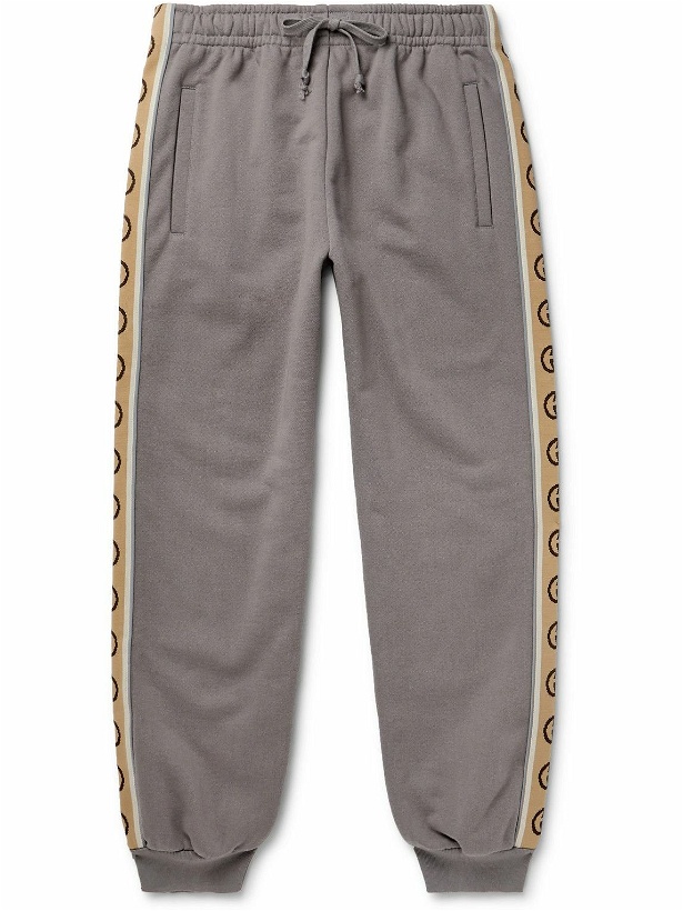 Photo: GUCCI - Tapered Logo-Jacquard Webbing-Trimmed Loopback Cotton-Jersey Sweatpants - Gray
