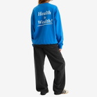 Sporty & Rich Women's Health is Wealth Crew Sweatshirt in Paris Blue