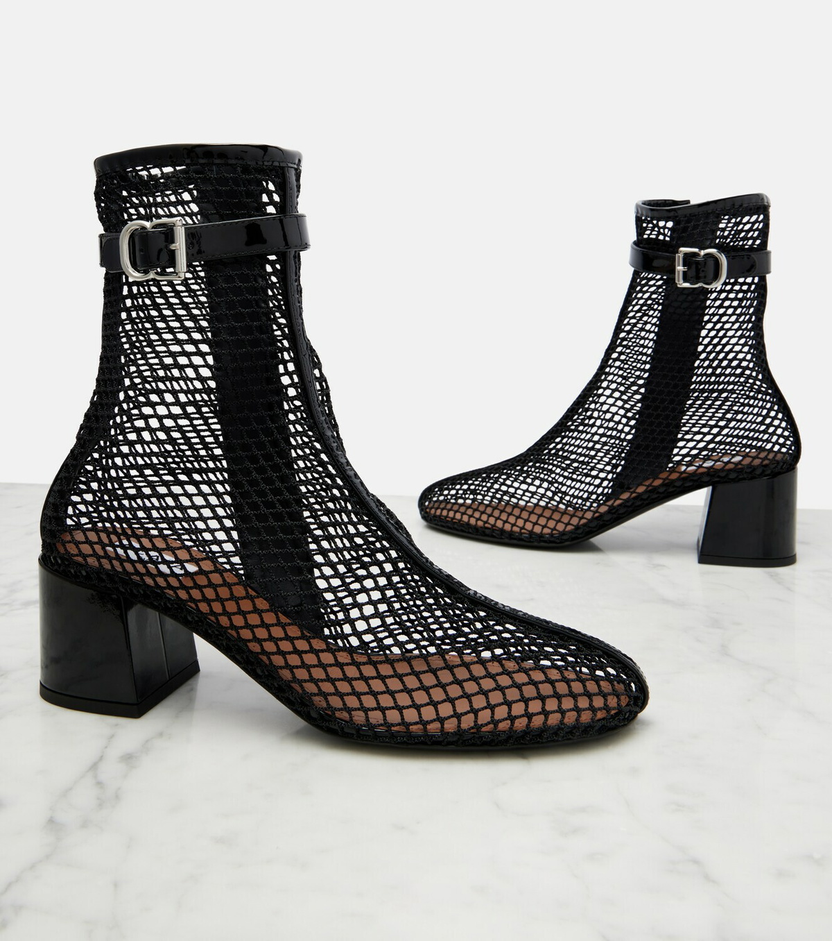 Alaïa Fishnet patent leather-trimmed ankle boots