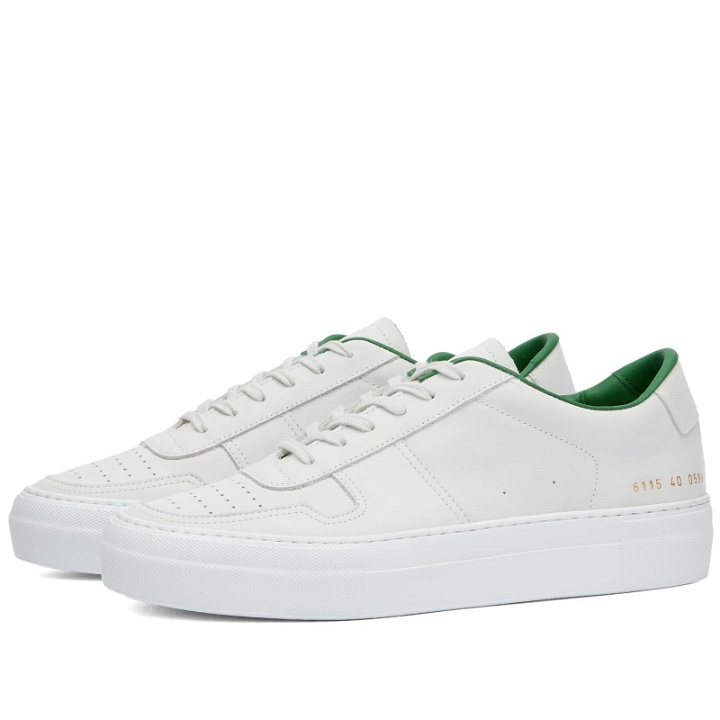 Photo: Woman by Common Projects Women's Basketball Summer Low Nubuck Sneakers in White/Green