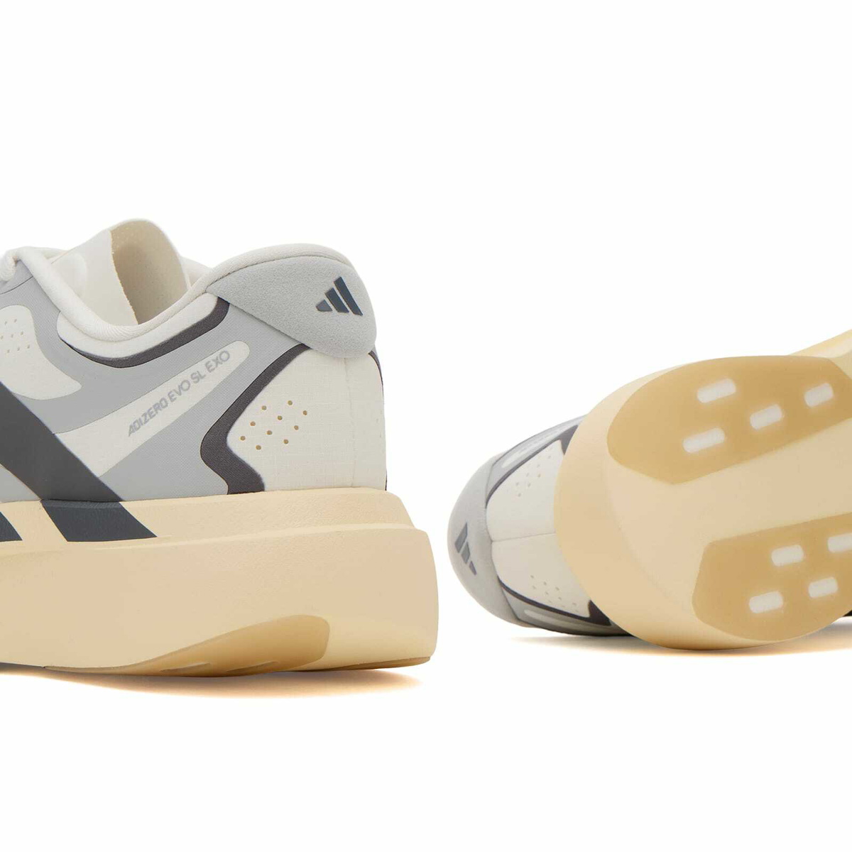 Adidas Men's Adizero Evo SL Exo Sneaker in White/Utility Black/Grey