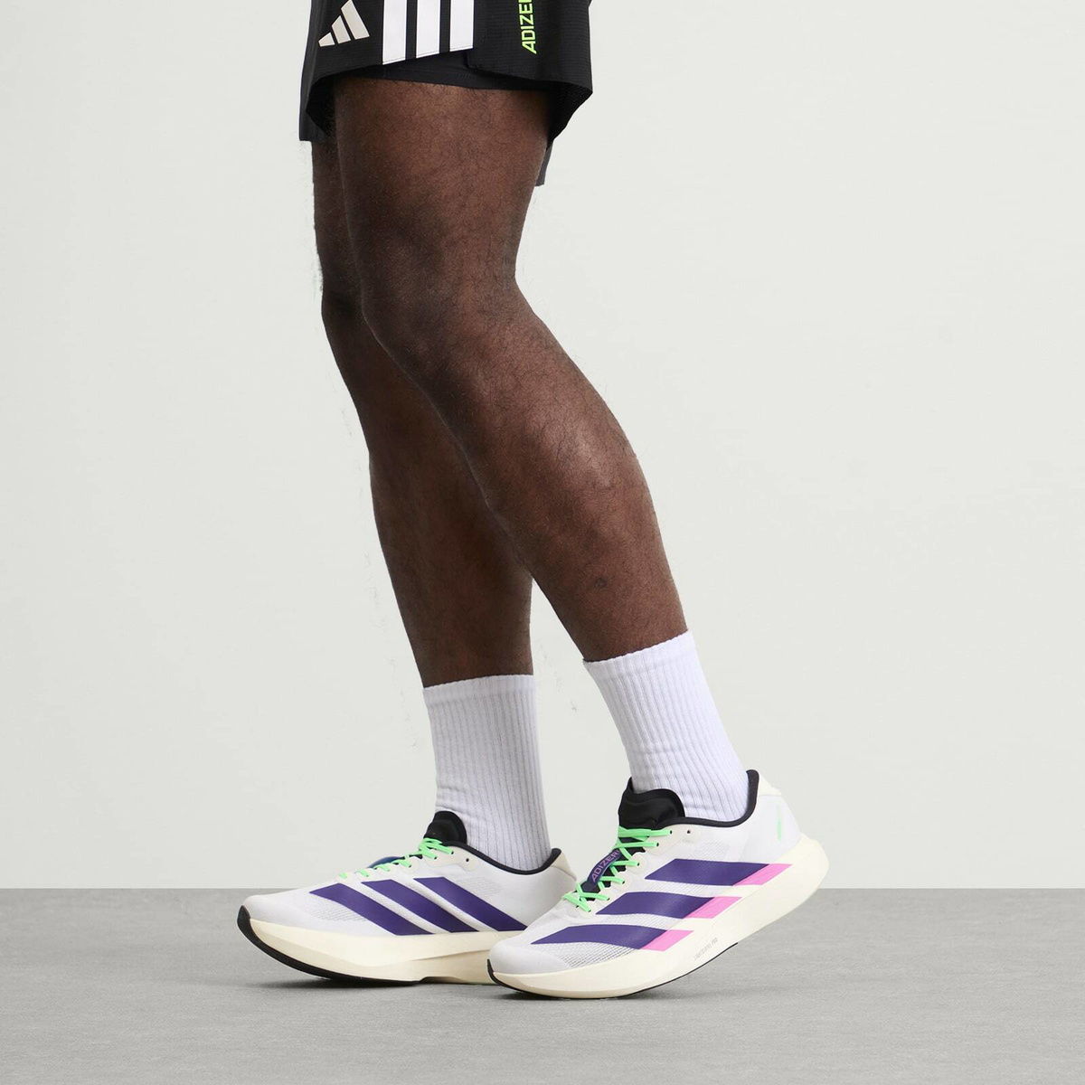 Adidas Running adidas Adizero Evo SL Sneaker in White/Collegiate Purple/Lime Burst