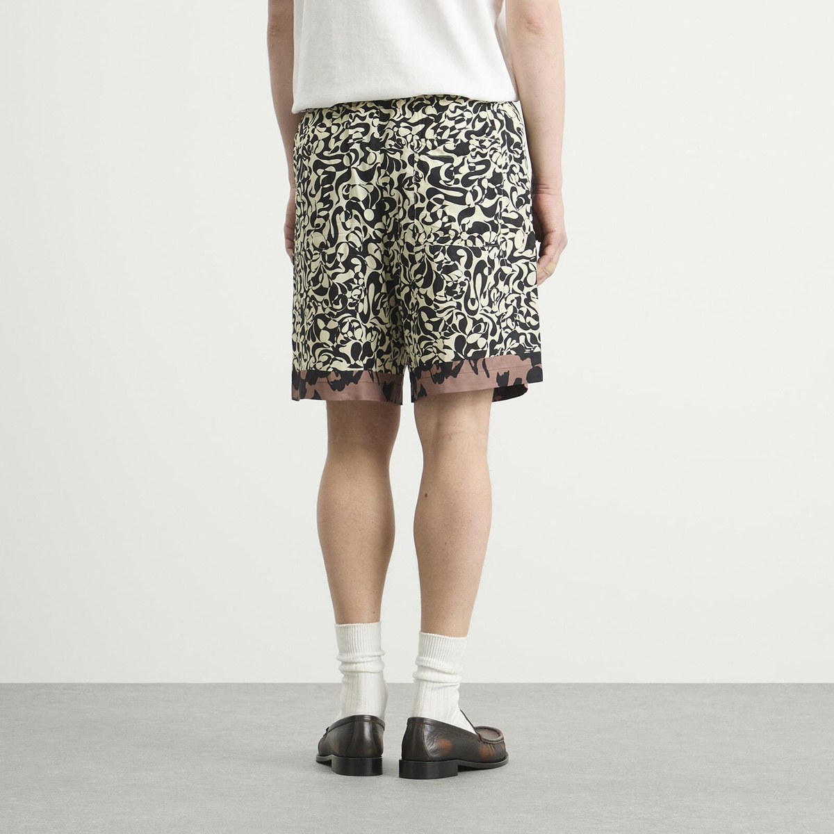 Dries Van Noten Men's Squiggle Border Print Shorts in Black