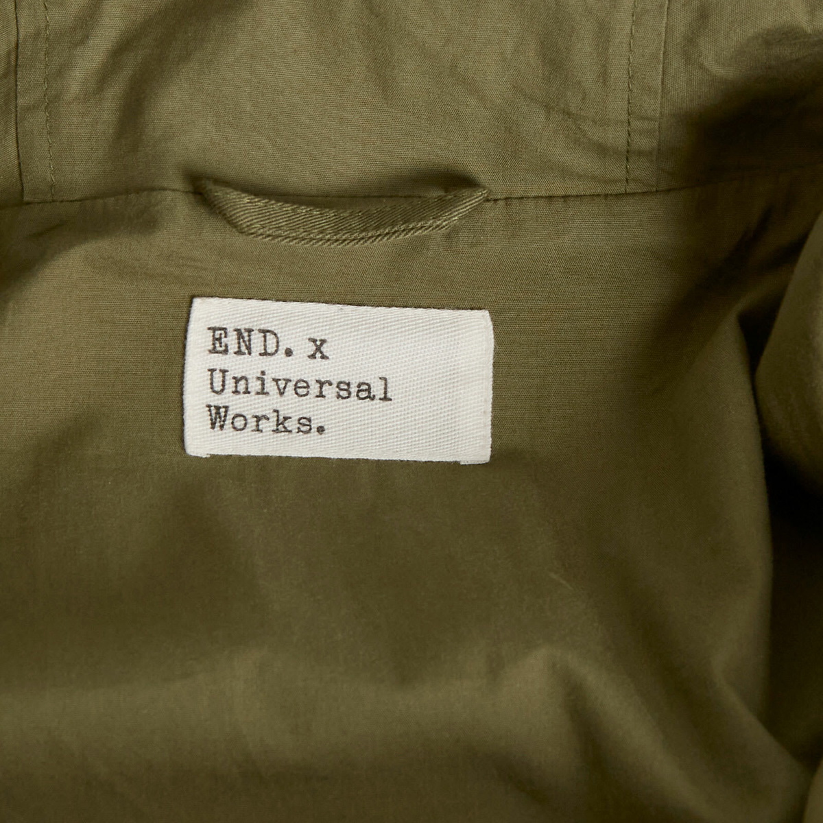END. x Universal Works Men's Shipp Inn Parka Jacket in Light Olive