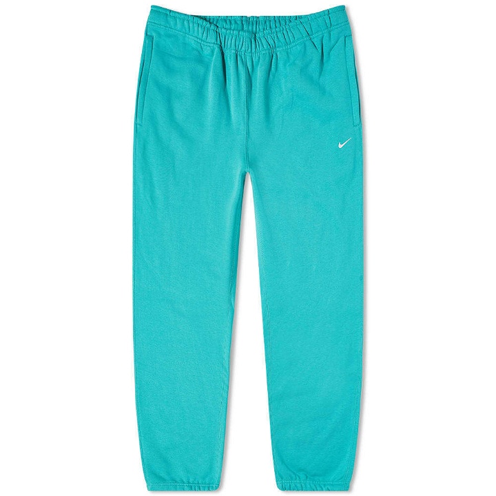 Photo: Nike Men's Solo Swoosh Heavyweight Pant in Washed Teal/White