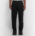 Vetements - Logo-Print Fleece-Back Cotton-Jersey Sweatpants - Men - Black