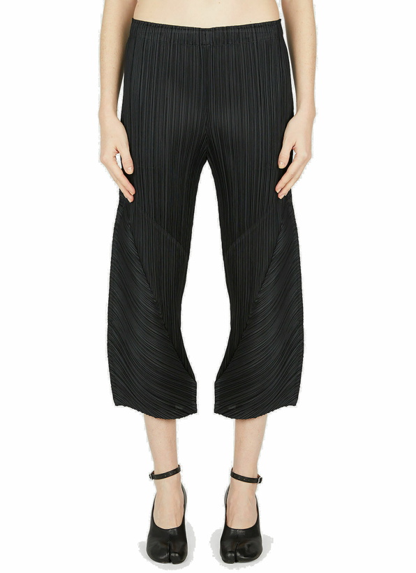 Photo: Pleats Please Issey Miyake - Cropped Pleated Pants in Black