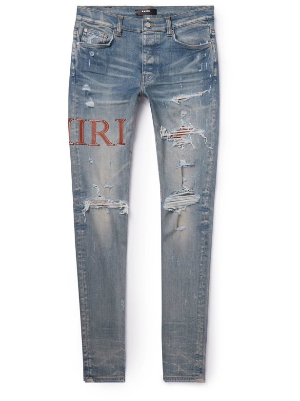 Photo: AMIRI - Skinny-Fit Leather-Trimmed Distressed Jeans - Blue