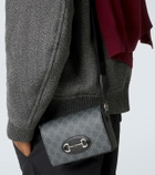 Gucci GG Supreme leather-trimmed canvas crossbody bag