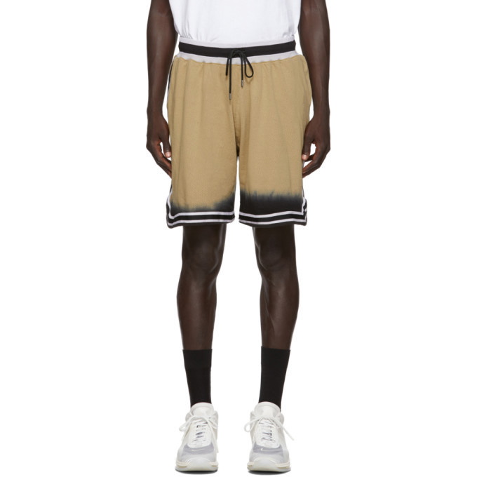 Photo: John Elliott Tan and Black Game Shorts