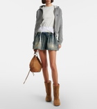 Balenciaga Distressed denim miniskirt