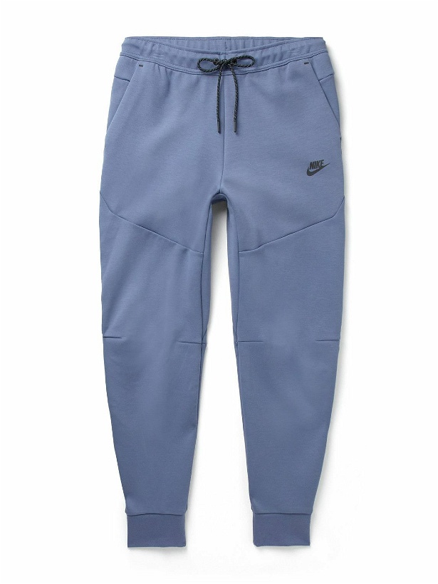 Photo: Nike - Sportswear Tapered Logo-Print Cotton-Blend Tech-Fleece Sweatpants - Blue