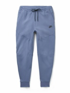 Nike - Sportswear Tapered Logo-Print Cotton-Blend Tech-Fleece Sweatpants - Blue