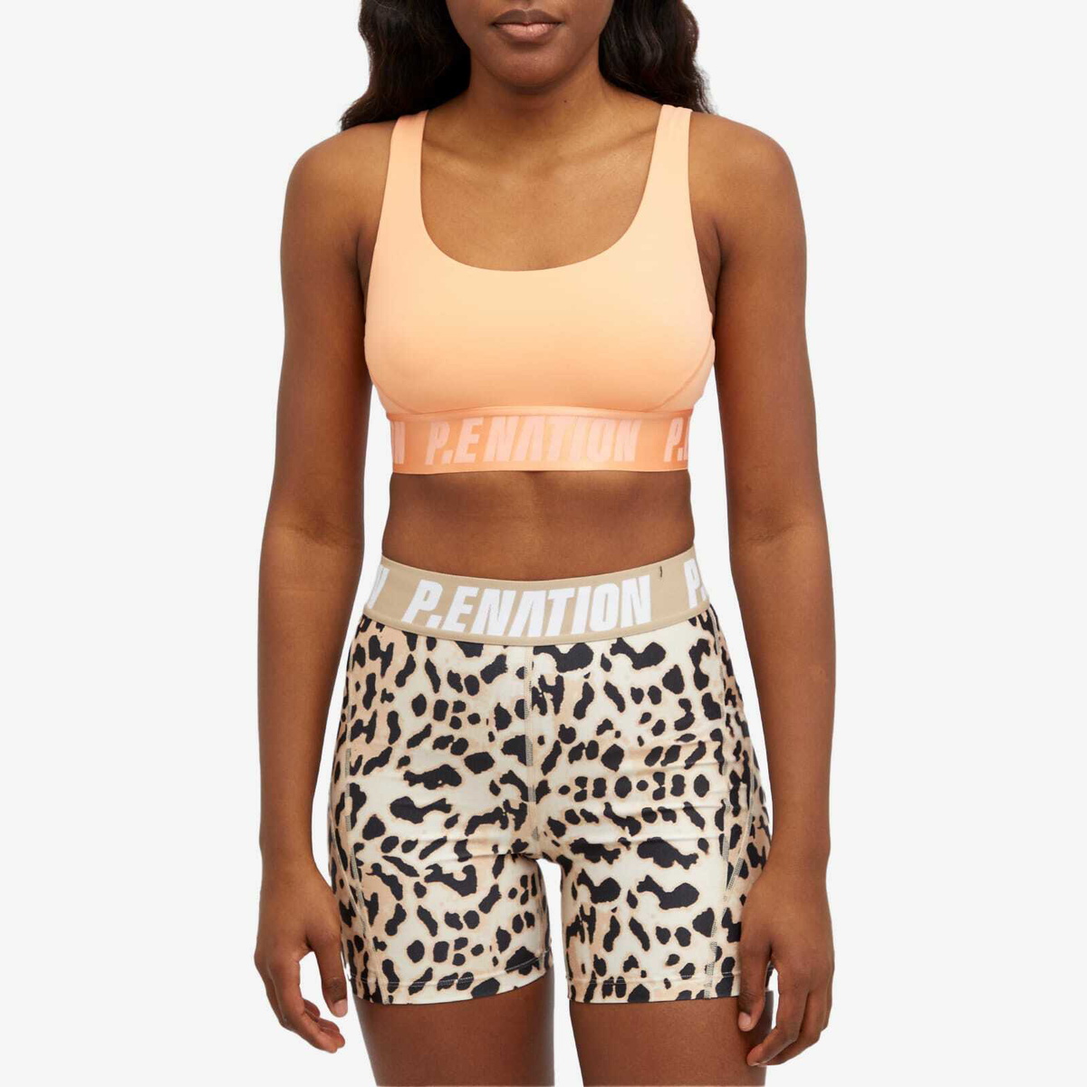 P.E Nation Women's Backcheck Sports Bra in Cantaloupe