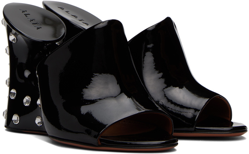 ALAIA FOLDED FLAT MULES WITH SPHERES ON BLACK CALFSKIN