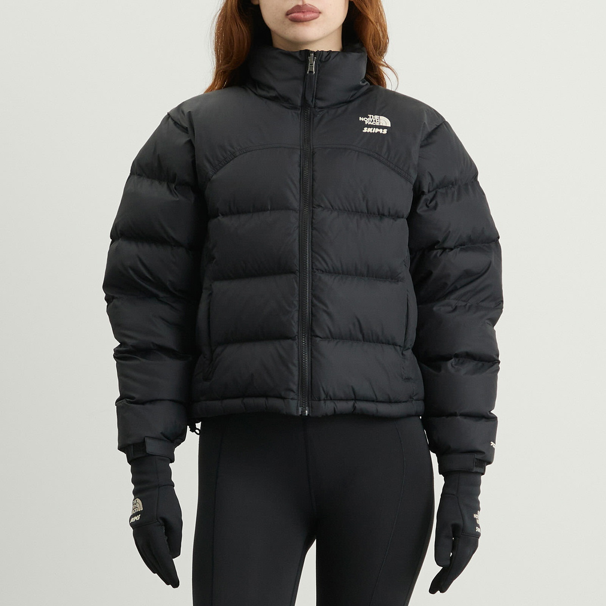 The North Face Women's x SKIMS 2000 Retro Shrunken Nuptse in The North Face Women's x SKIMS 2000 Retro Shrunken Nuptse in