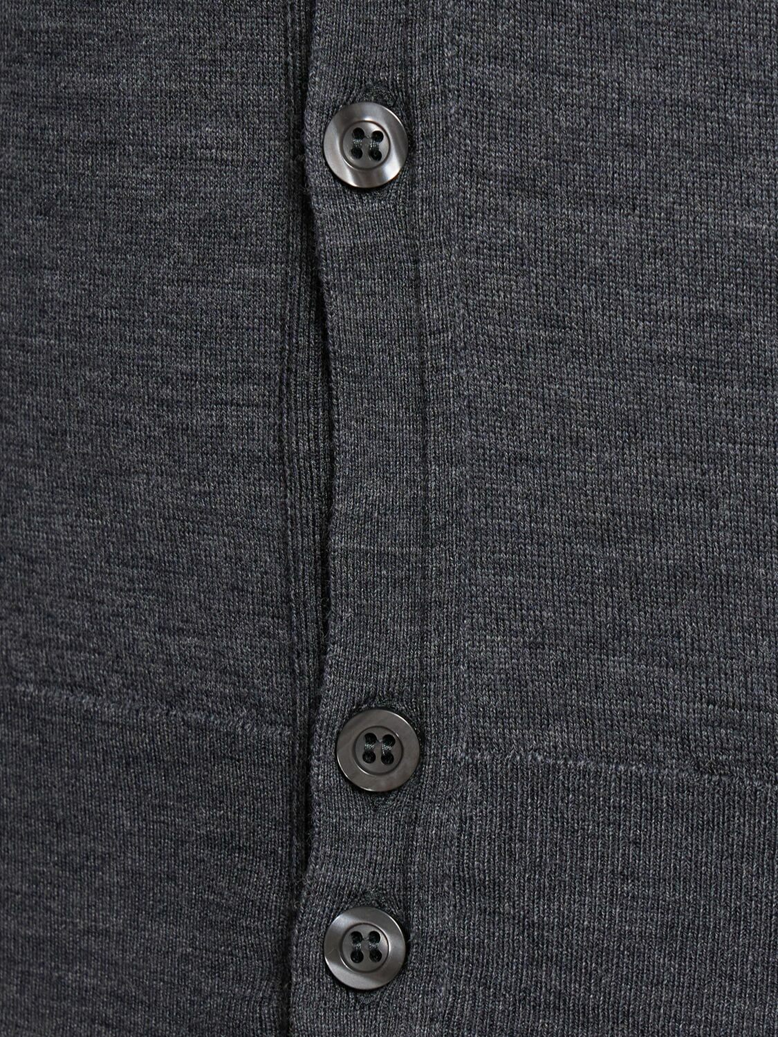 Close-up of a knitted cardigan button placket
