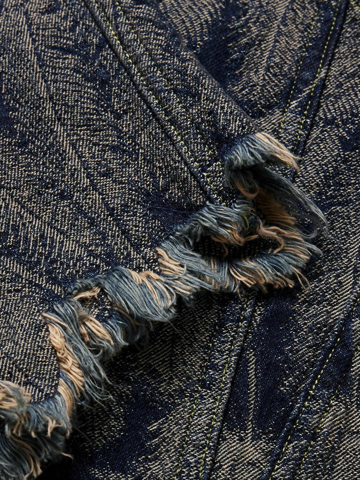Fragment of blue jeans fabric with a hole, full frame, close up 24009733  Stock Photo at Vecteezy