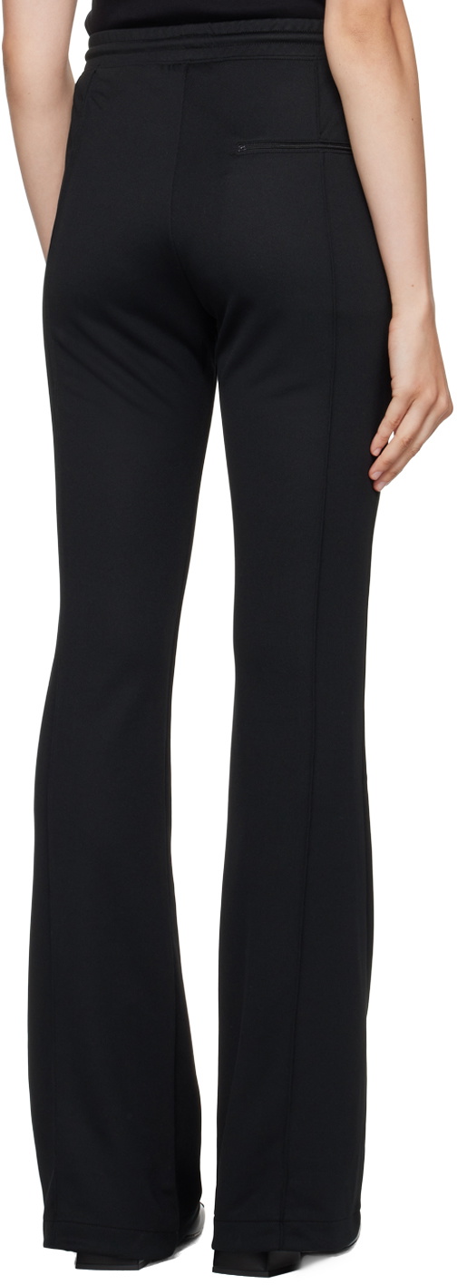 Ribbed-knit high-rise flare pants in black - Courreges