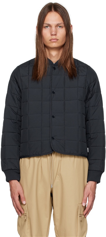 Photo: RAINS Navy Quilted Bomber Jacket