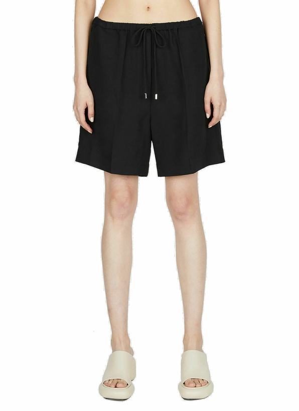 Photo: TOTEME - Press Creased Drawstring Shorts in Black
