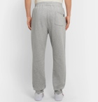 Stüssy - Tapered Mélange Loopback Cotton-Jersey Sweatpants - Gray
