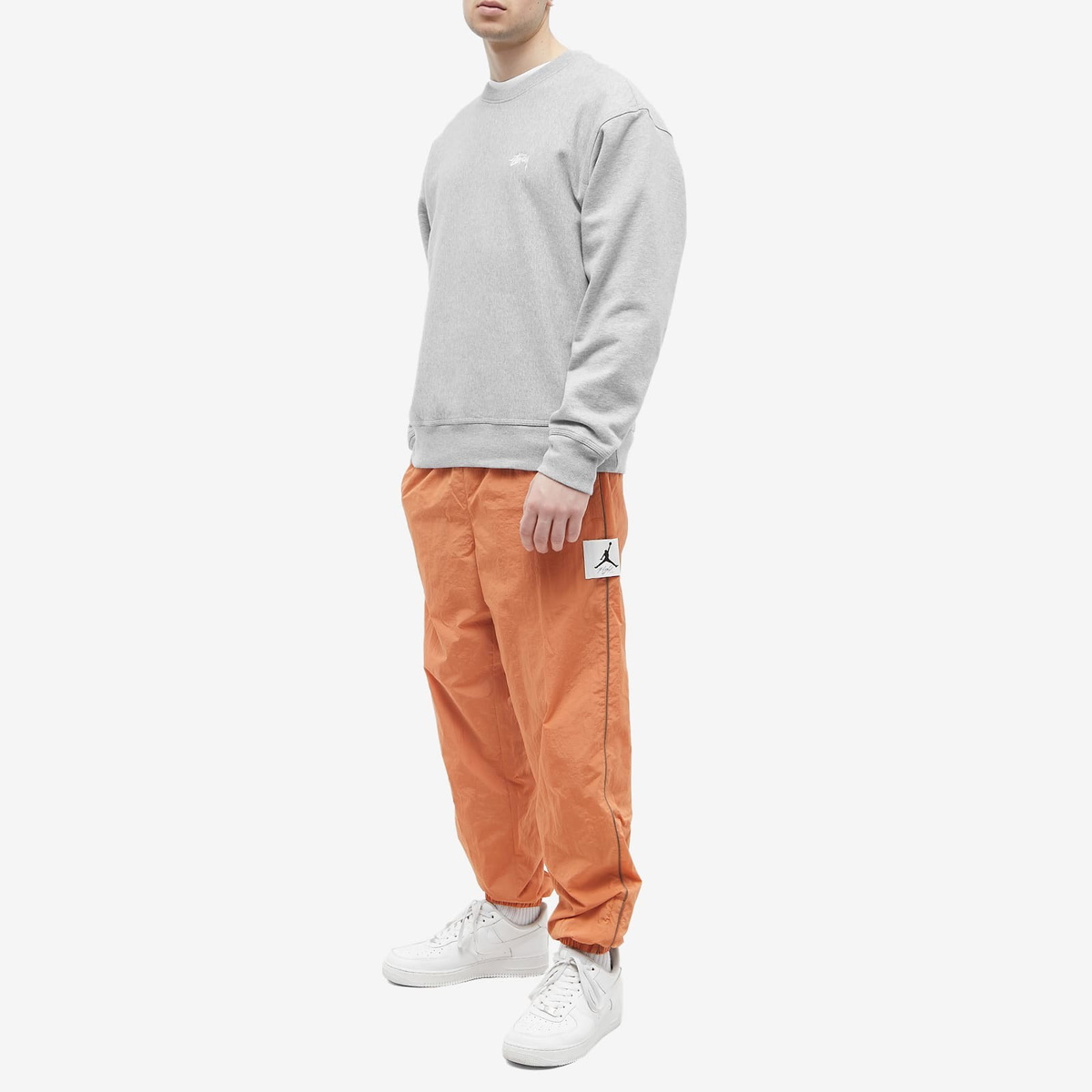 Air Jordan Men's Essential Statement Warmup Pant in Rust Oxide