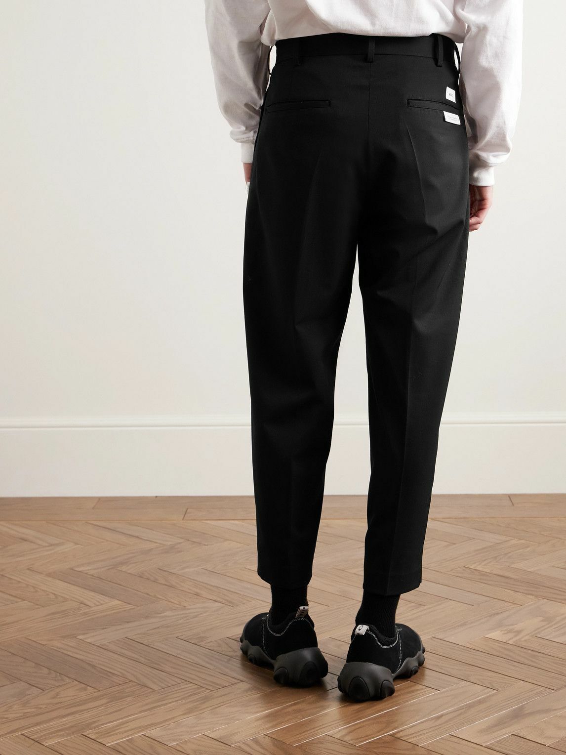 WTAPS - Cropped Tapered Logo-Appliquéd Pleated Twill Trousers - Black