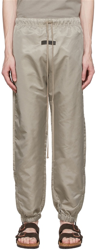 Photo: Fear of God ESSENTIALS Taupe Nylon Track Pants