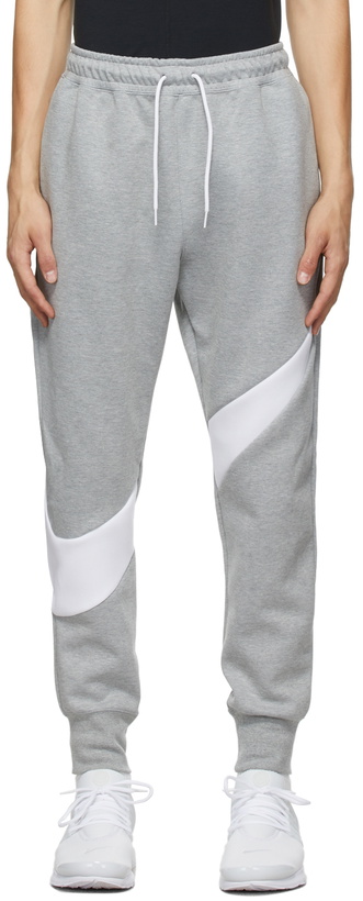 Photo: Nike Grey Sportswear Swoosh Tech Lounge Pants