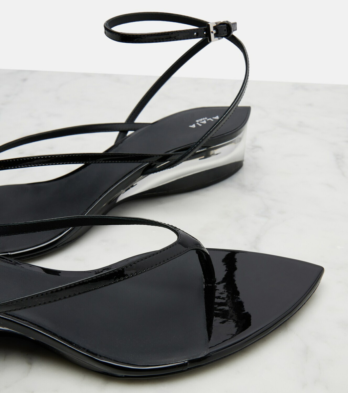 Alaïa Invisible patent leather thong sandals
