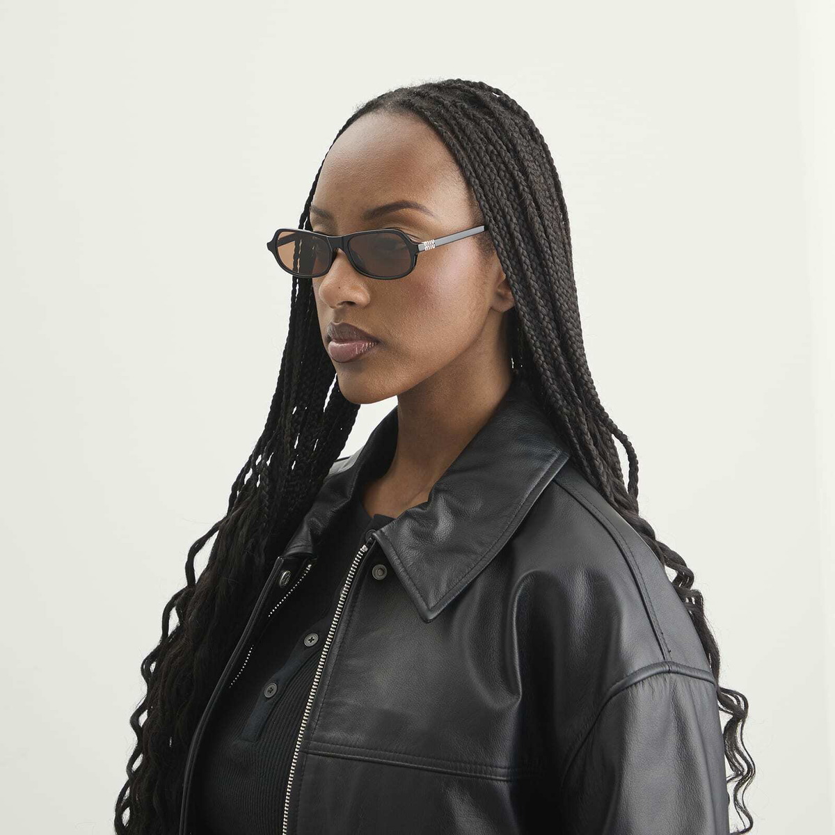 Miu Miu Eyewear B10SU Sunglasses in Black/Brown 