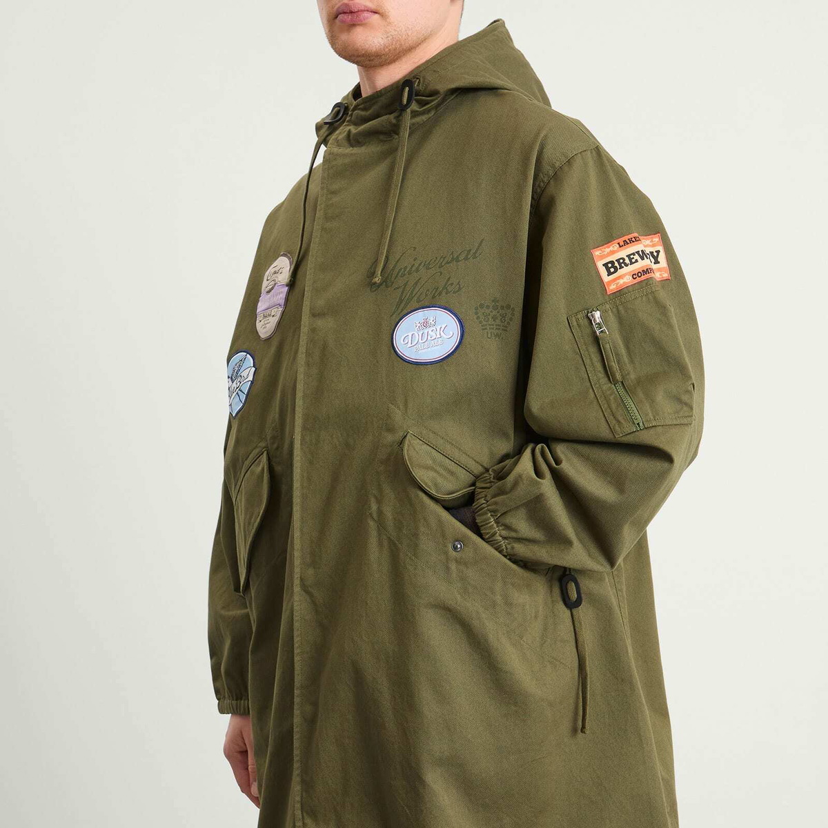 END. x Universal Works Men's Shipp Inn Parka Jacket in Light Olive