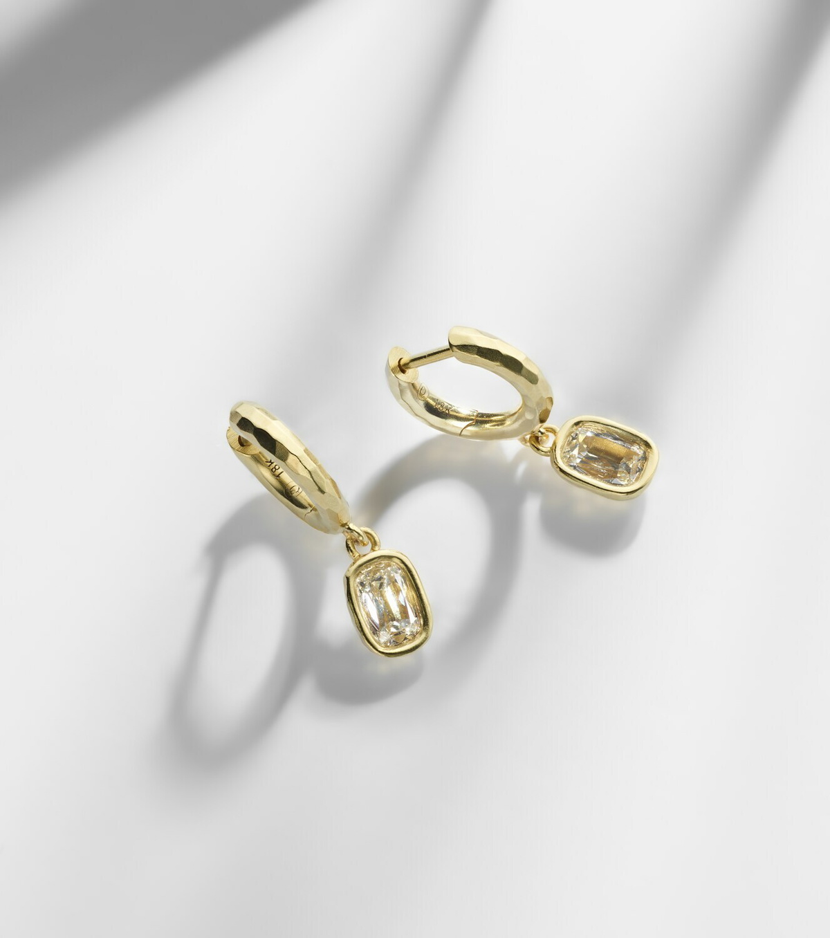 Octavia Elizabeth Hidden Gem 18kt gold huggies with diamonds