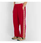 Gucci - Tapered Logo-Appliquéd Webbing-Trimmed Piped Velvet Sweatpants - Red