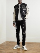 AMIRI - Skinny-Fit Logo-Appliquéd Panelled Distressed Jeans - Black