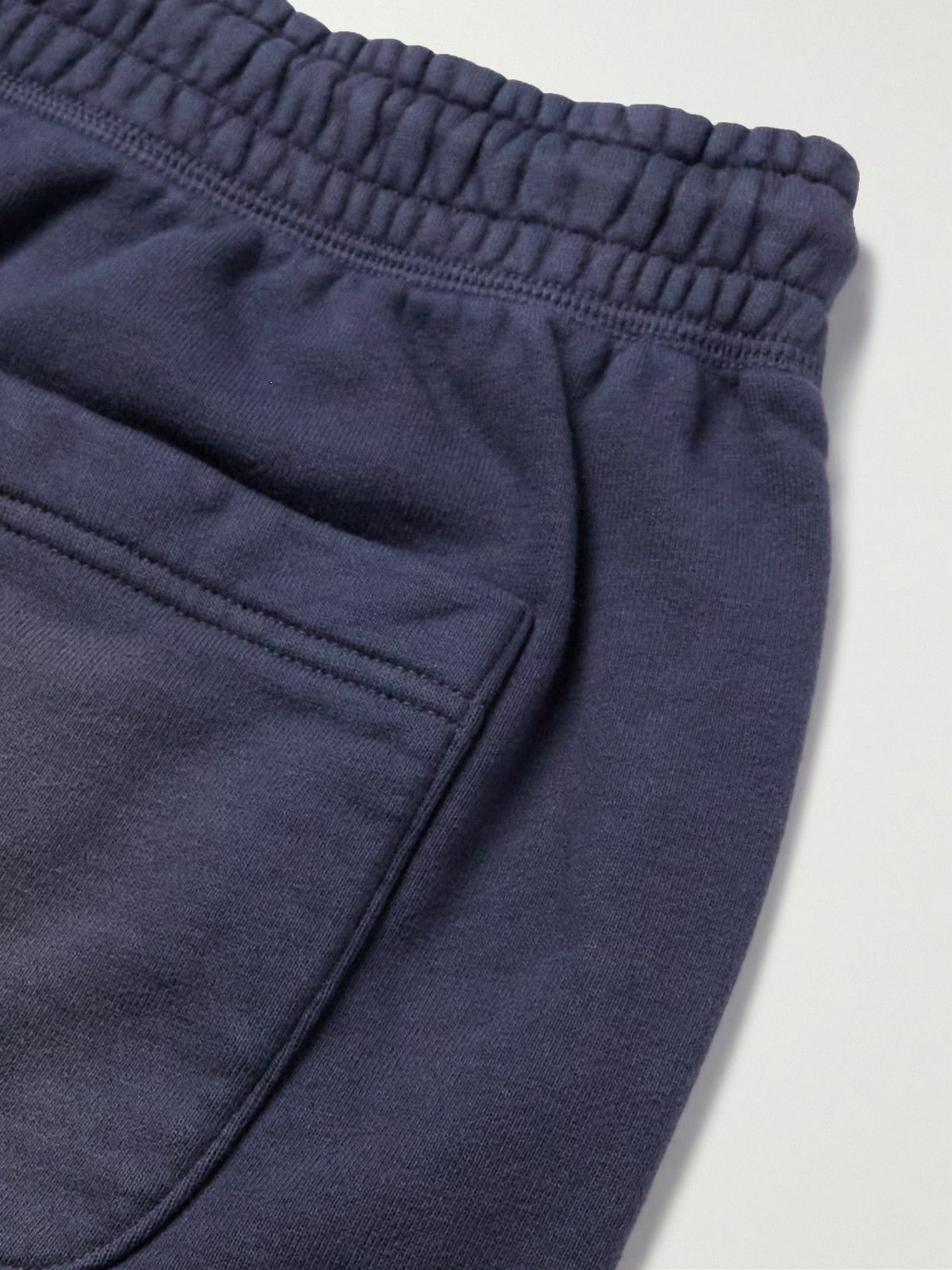 SAINT Mxxxxxx - Collegiate Tapered Logo-Print Cotton-Jersey Sweatpants - Blue