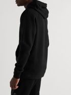 C.P. Company - Logo-Appliquéd Garment-Dyed Cotton-Jersey Hoodie - Black