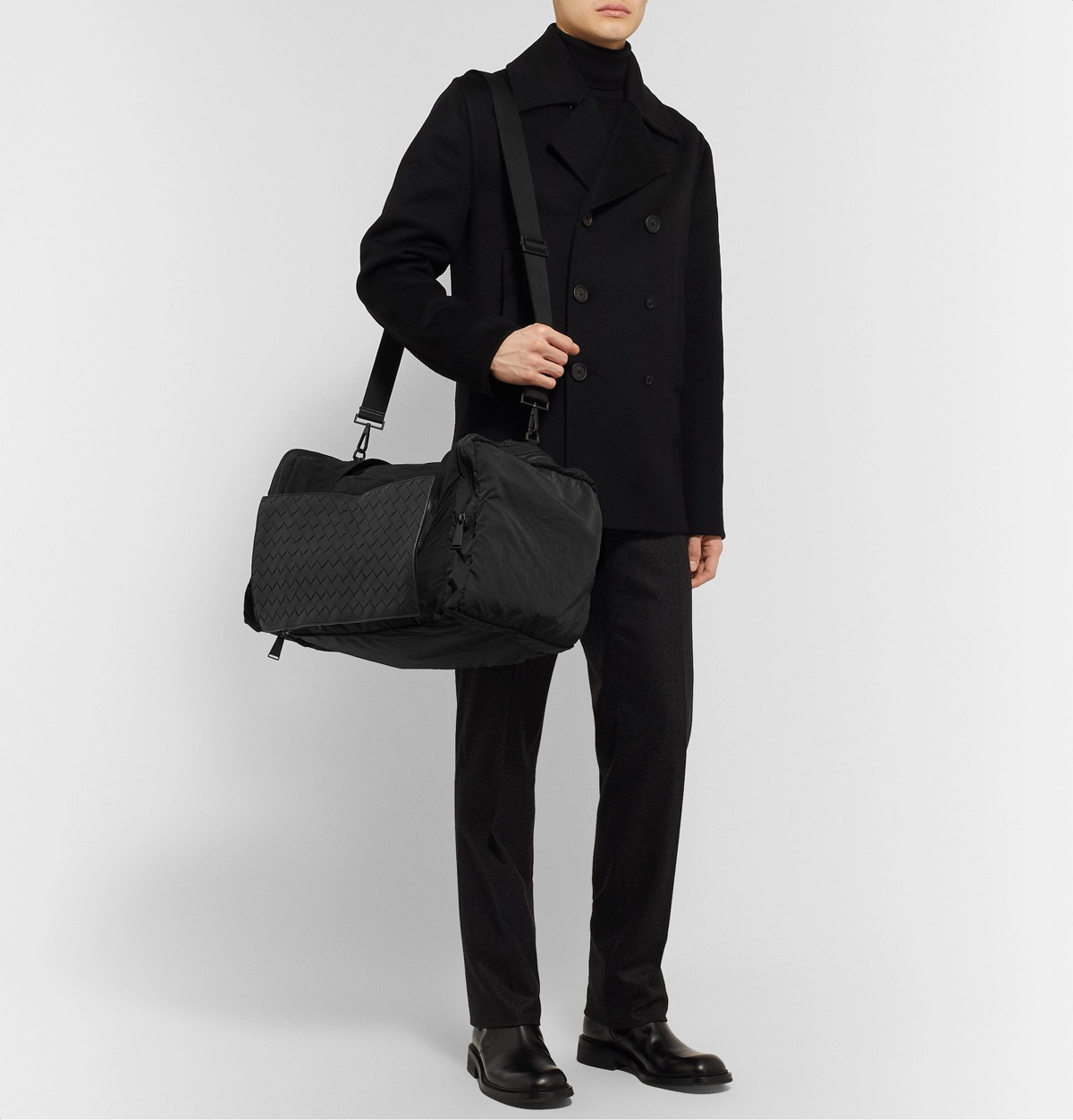 Bottega Veneta Black Leather Intrecciato Duffle Bag worn by Travis