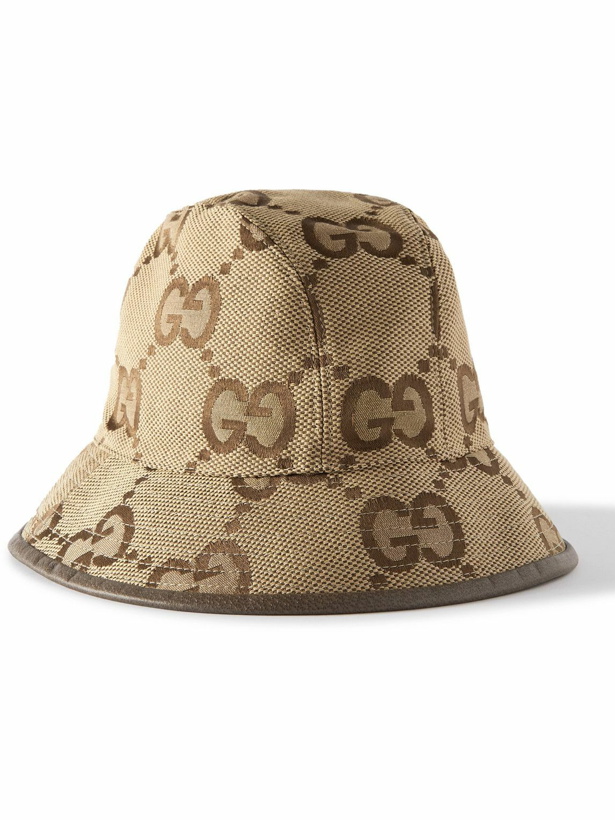 Photo: GUCCI - Leather-Trimmed Monogrammed Cotton-Blend Canvas Bucket Hat - Brown