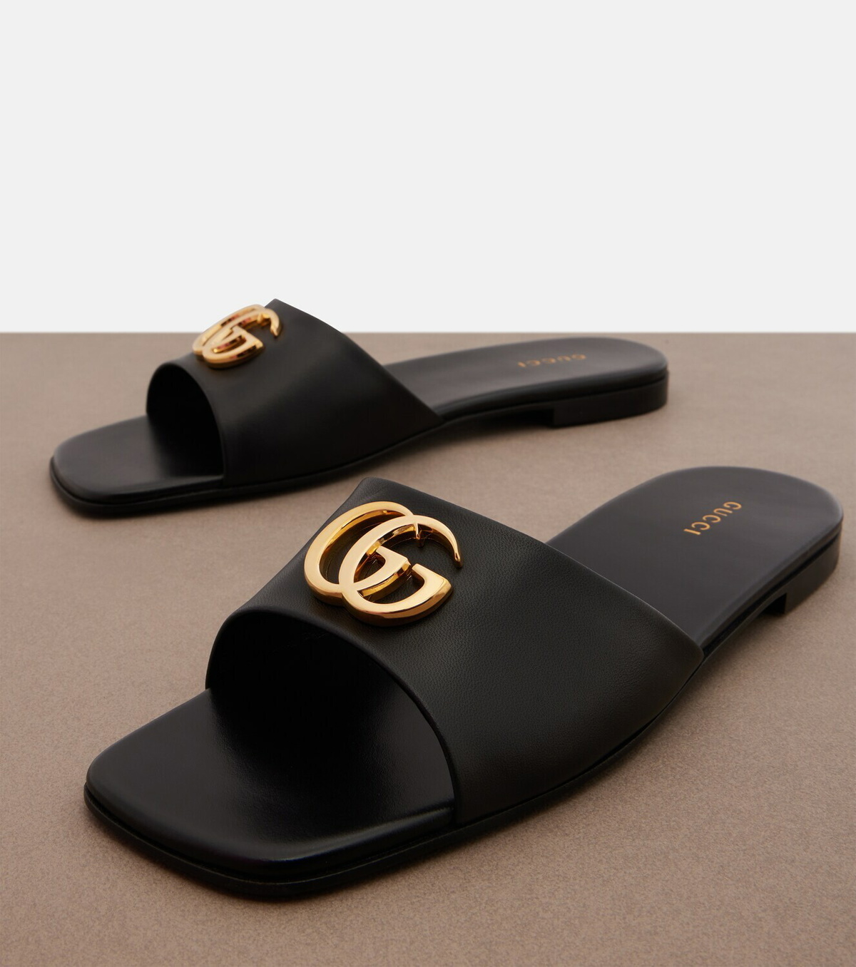 Gucci Double G leather slides