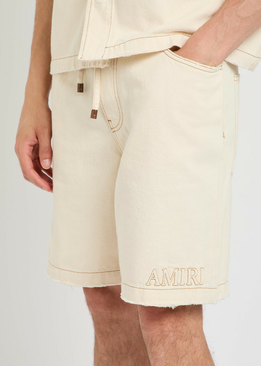 Amiri Logo-embossed Distressed Denim Shorts Ecru