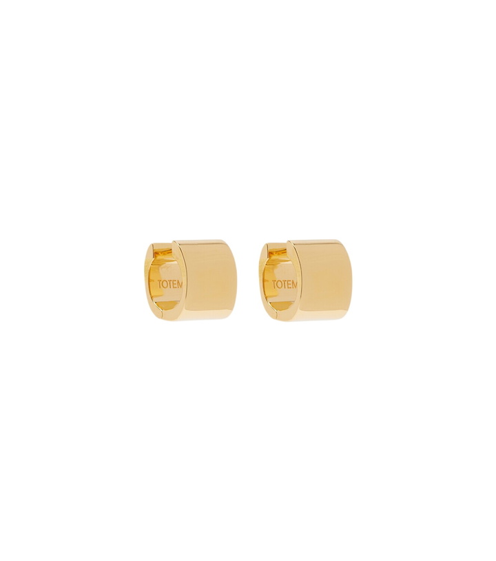 Photo: Toteme Signature Petite huggie earrings