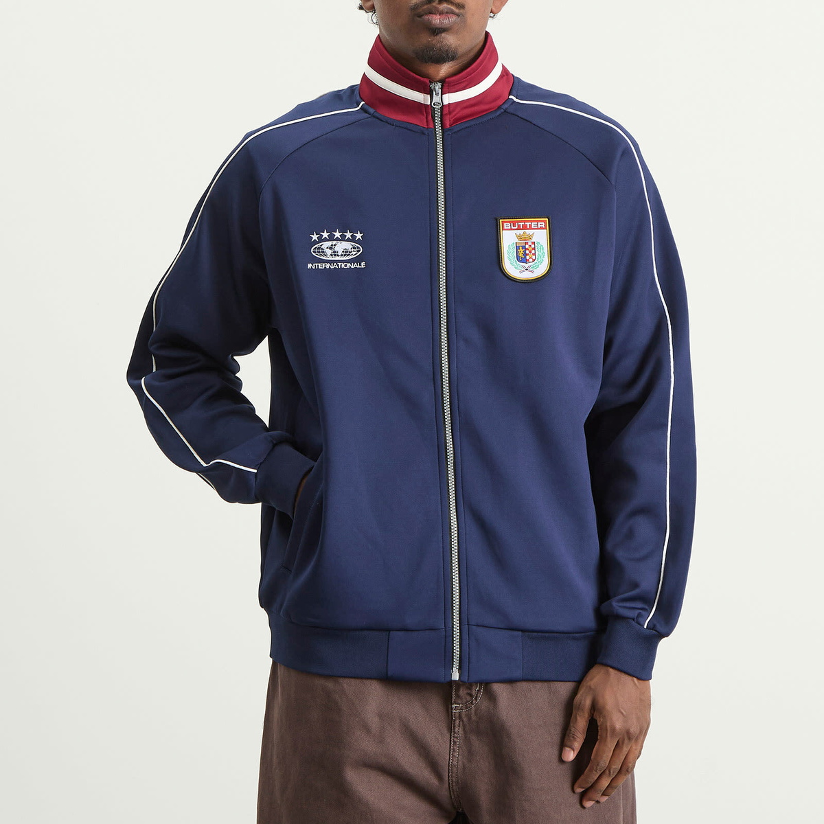 Butter Goods Men's Internationale Track Jacket in Navy