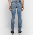 AMIRI - Skinny-Fit Distressed Paint-Splattered Stretch-Denim Jeans - Light denim